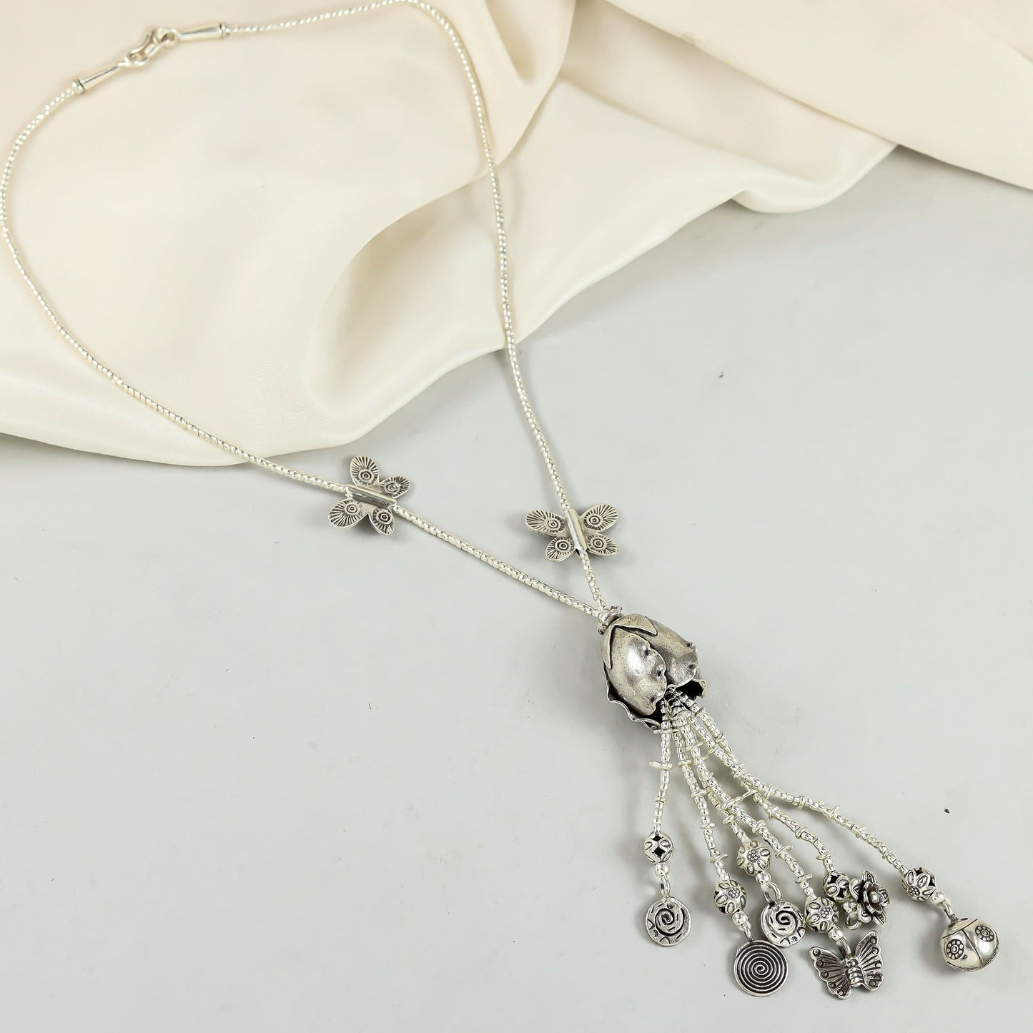 Silver Necklace With Intricate And Leaf Motifs