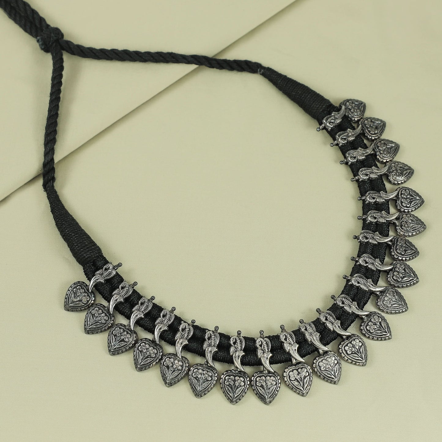 Tribal Elegance Handwoven Thread Silver Necklace