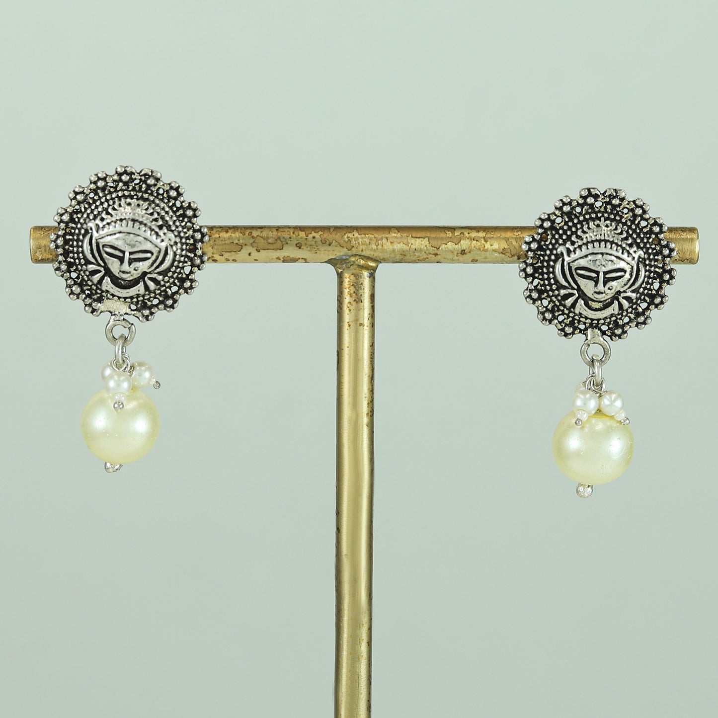 Avantika Tribal Silver Pearl Drop Earrings With Deity Motif