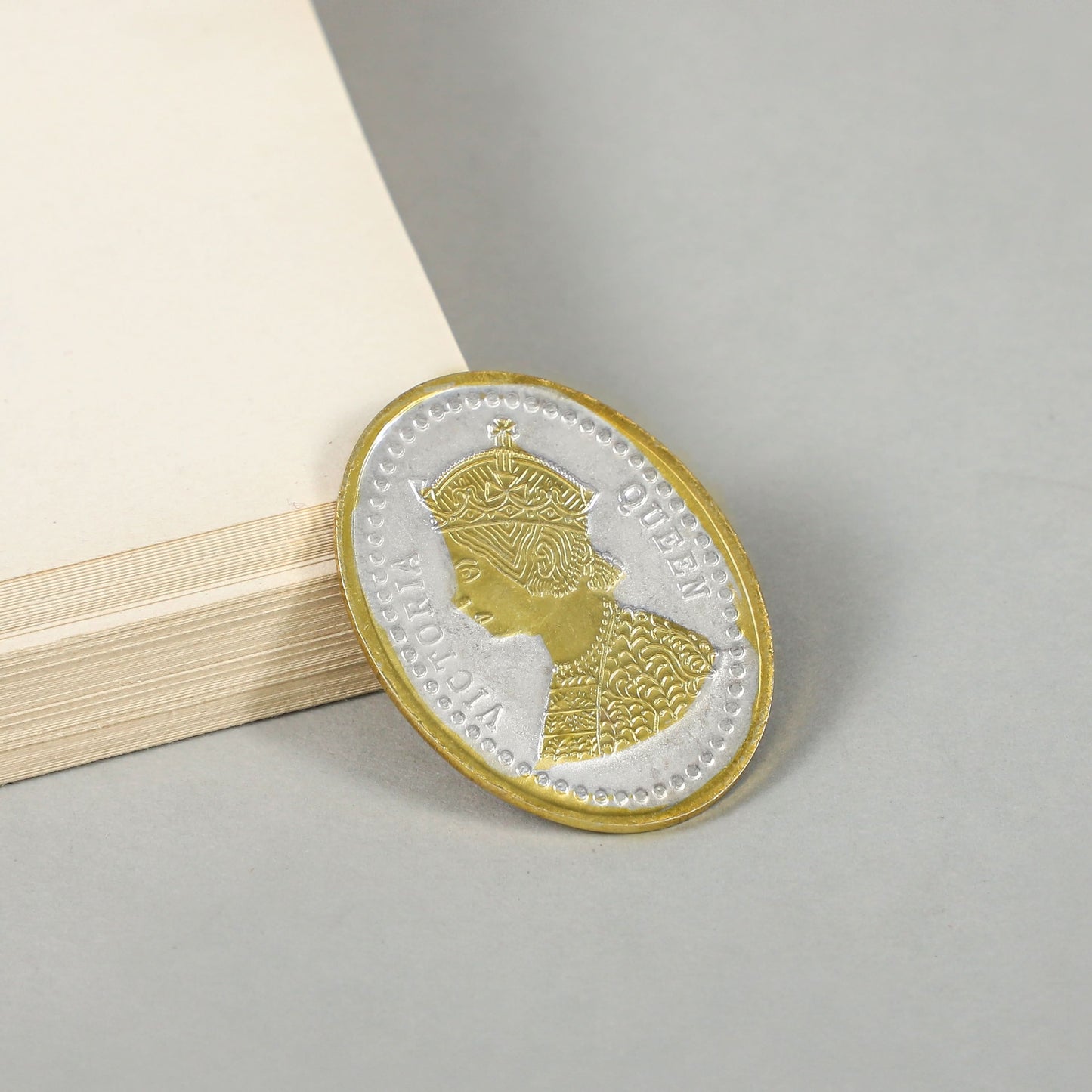 Golden Queen Coin- Elegant silver coin with intricate gold polish