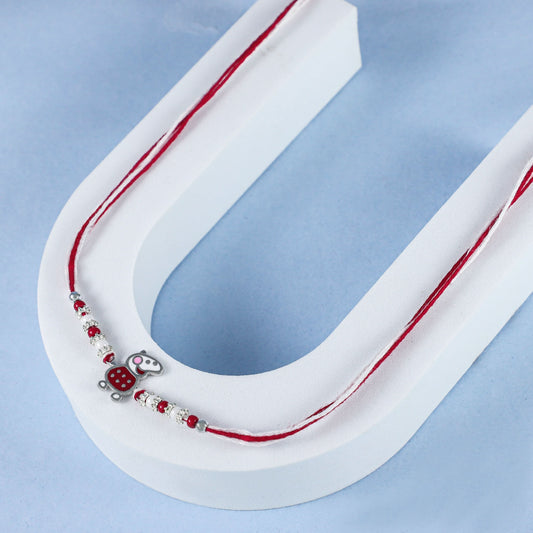 Cute  Silver Rakhi with Red and White Beads