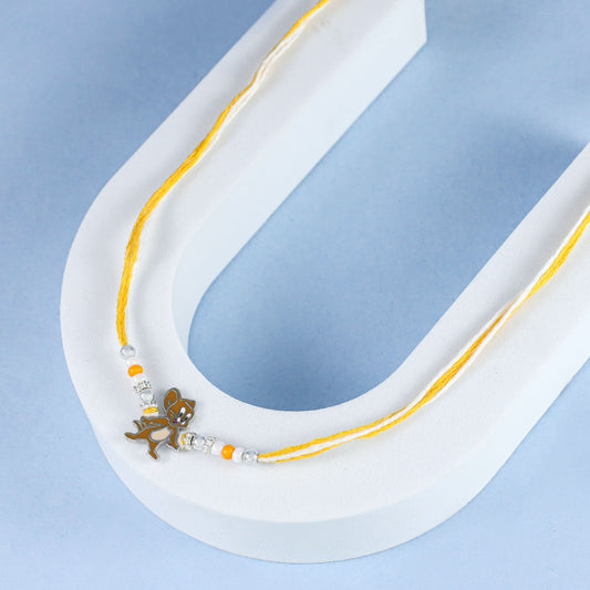 Playful Dog Silver  Rakhi with Yellow and White Thread