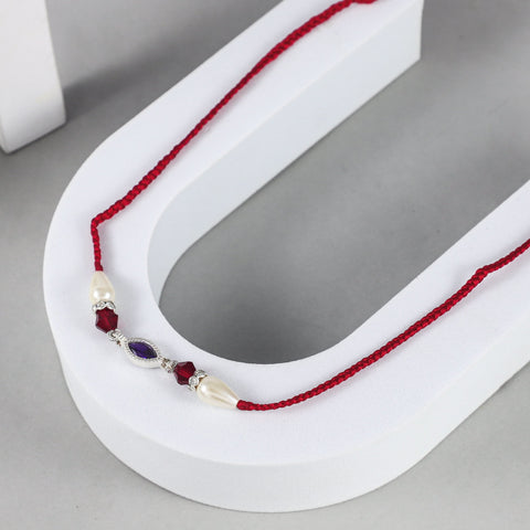 Graceful Marquise Stone Silver Rakhi with Pearl and Crystal Beads