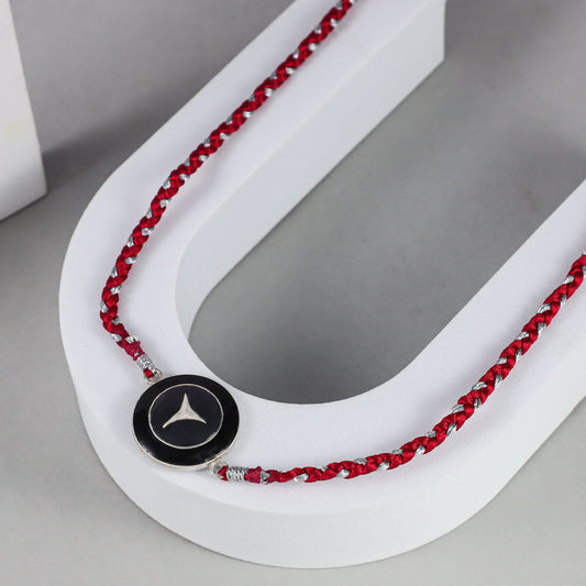 Bold Black Emblem Silver Rakhi on Red-Silver Braided Thread