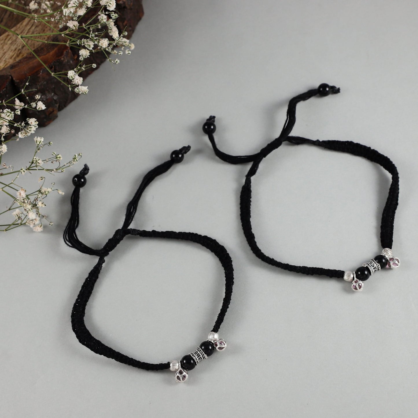 black-thread anklets with silver charm