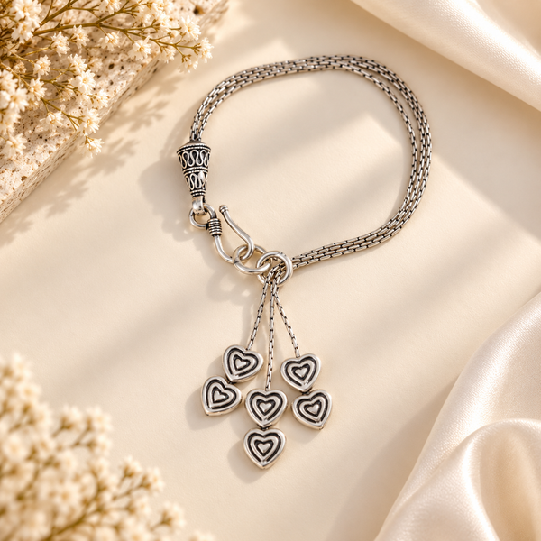 Aarohi Hearts Tassel Silver Bracelet