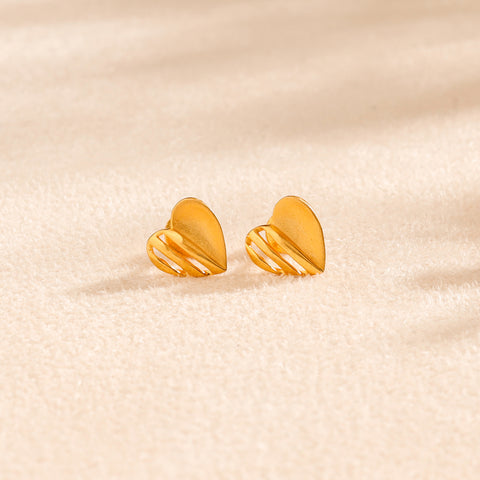 Tiny Heart Glow Studs Gold Earrings