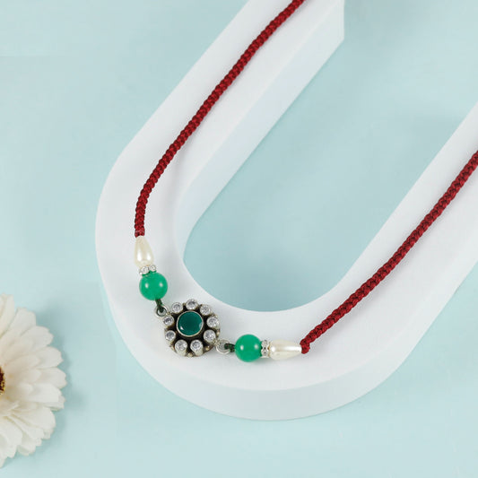 Elegant Silver Rakhi  with Dori Tie