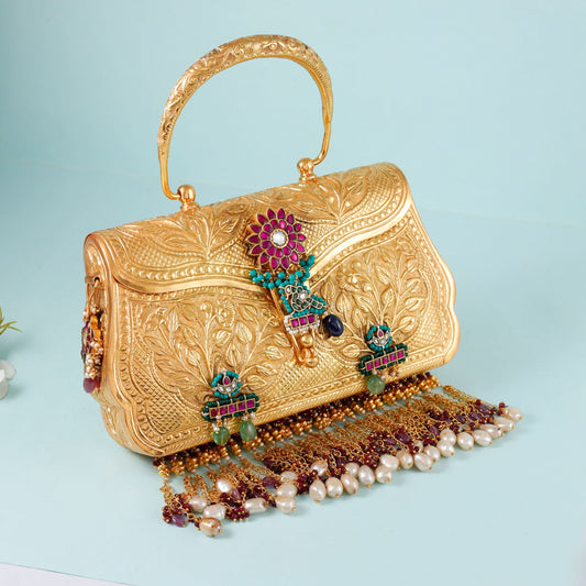 elegance and traditional temple-art-inspired design of this golden handbag floral Purse