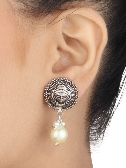 Avantika Tribal Silver Pearl Drop Earrings With Deity Motif