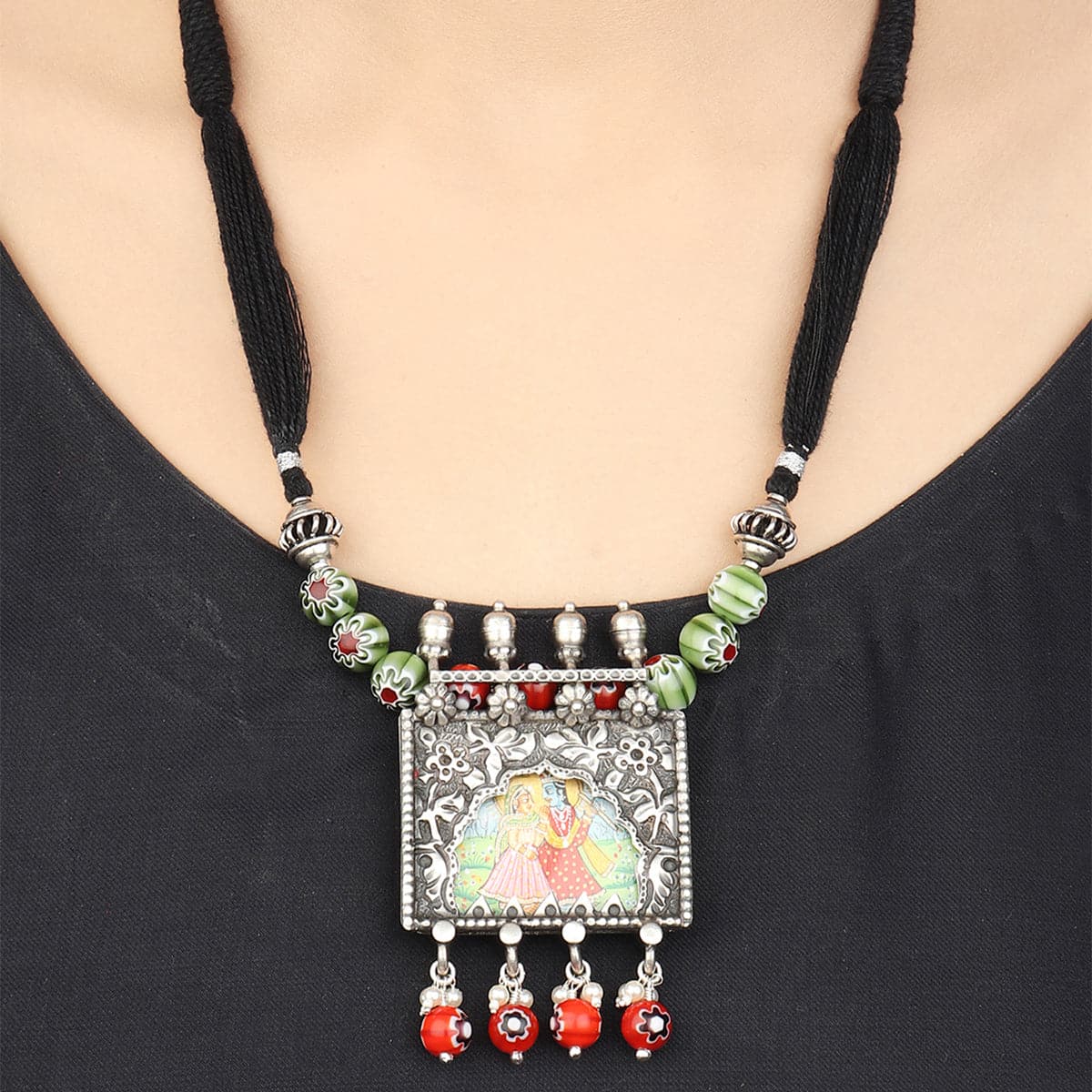 Aashka Green-Red Thread Tribal Silver Necklace With Hand Painted Deity Motif